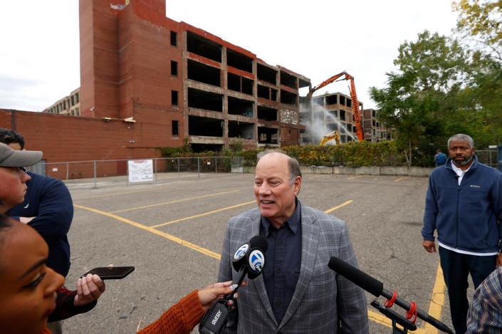 Detroit Mayor Mike Duggan talks to the media as part of the Packard Plant was being torn down behind him in Detroit on Thursday, September 29, 2022. Duggan is part of the bipartisan group that has called for changes to how long state lawmakers can serve in Lansing.