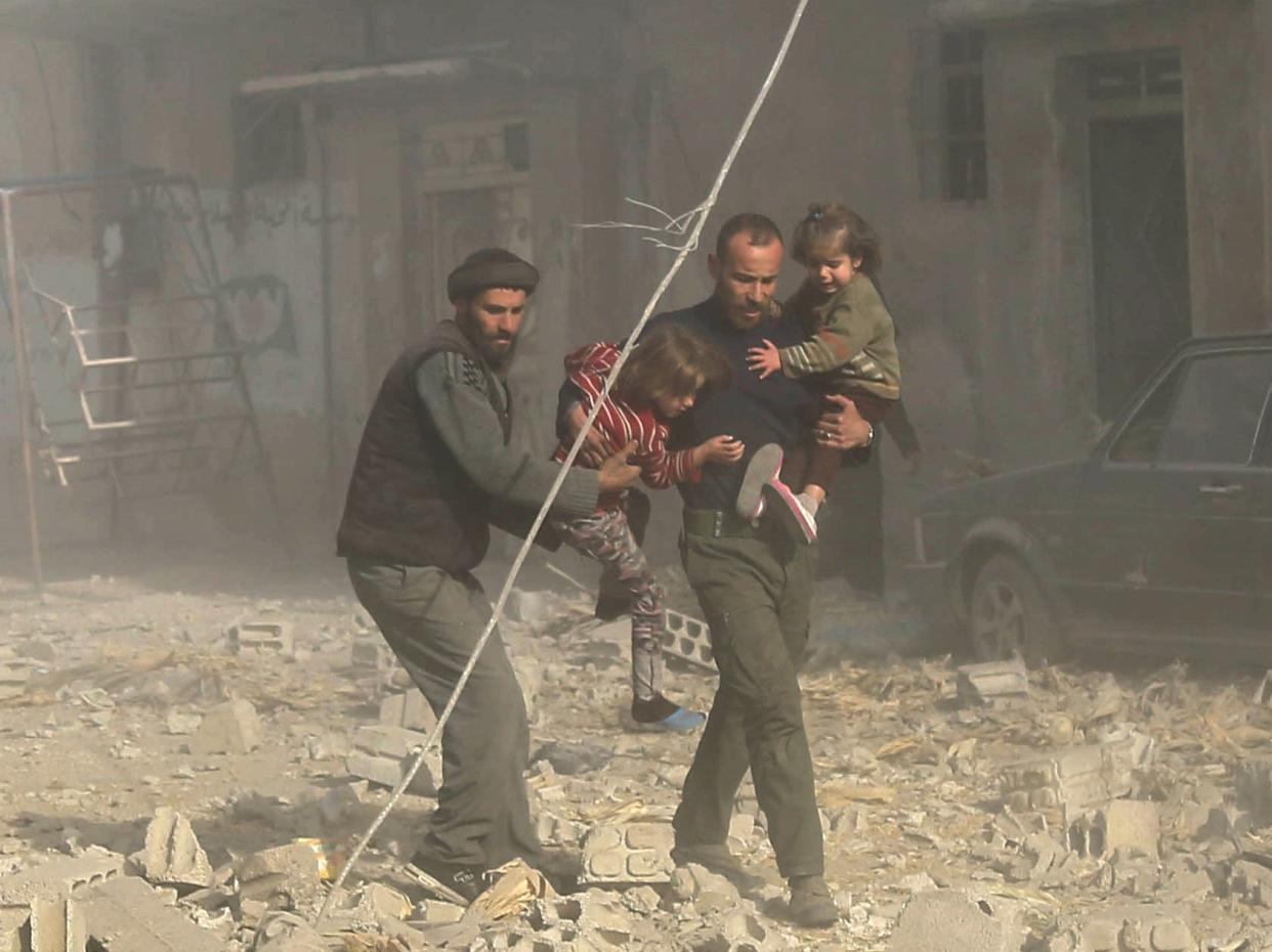 Syrians travel through rubble after airstrikes&nbsp;pounded residential areas in the Eastern Ghouta region on Dec. 3, 2017. (Photo: Tark Almasry/Anadolu Agency via Getty Images)