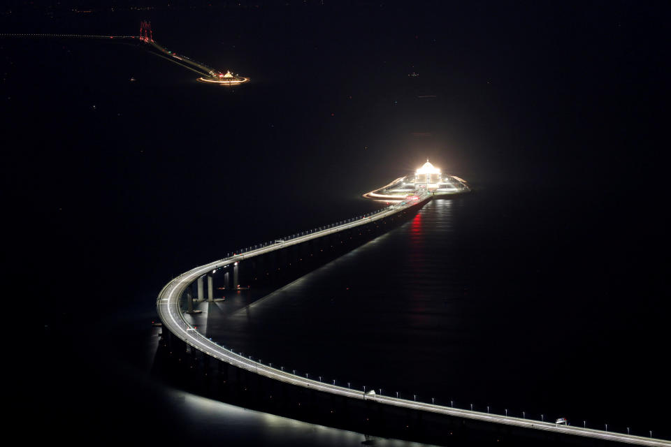 <p>An evening view of the Hong Kong-Zhuhai-Macau bridge and its entrances to a cross sea tunnel, off Lantau island in Hong Kong (REUTERS/Bobby Yip) </p>