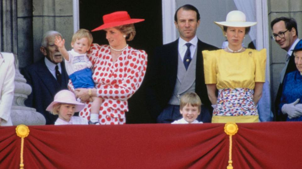 British Royals Diana, Princess of Wales  holding her son, Prince Harry, alongside Captain Mark Phillips and Anne, Princess Royal, with their daughter Zara Phillips (front left) and Diana's son, Prince William (front right), Prince Richard, Duke of Gloucester, and Princess Alice, Duchess of Gloucester (1901-2004; partially obscured at the right edge of the image) watching the Trooping the Colour ceremony from the balcony of Buckingham Palace in London, England, 14th June 1986