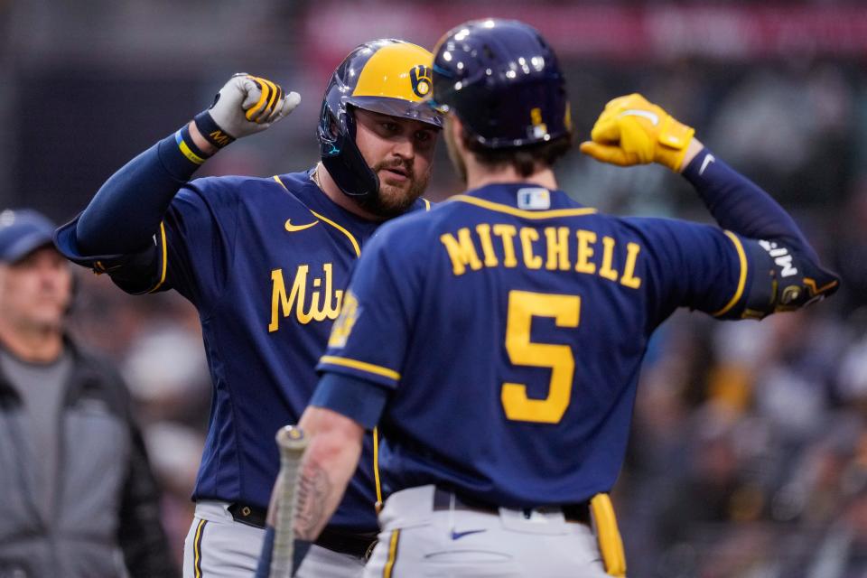 Brewers first baseman Rowdy Tellez is greeted by Garrett Mitchell after belting a two-run home run against the Padres in the first inning Thursday night.