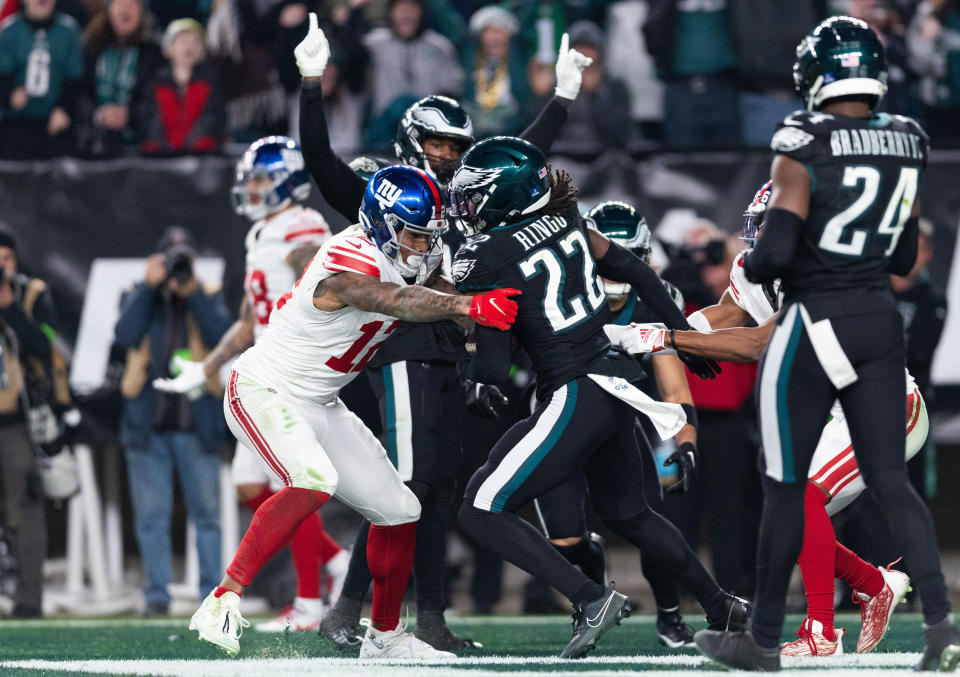 Dec 25, 2023; Philadelphia, Pennsylvania, USA; Philadelphia Eagles cornerback Kelee Ringo (22) intercepts a ball in front of New York Giants tight end <a class="link " href="https://sports.yahoo.com/nfl/players/28592/" data-i13n="sec:content-canvas;subsec:anchor_text;elm:context_link" data-ylk="slk:Darren Waller;sec:content-canvas;subsec:anchor_text;elm:context_link;itc:0">Darren Waller</a> (12) in the final seconds of a victory at Lincoln Financial Field. Mandatory Credit: Bill Streicher-USA TODAY Sports