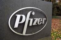 The Pfizer logo is seen at their UK commercial headquarters in Walton Oaks