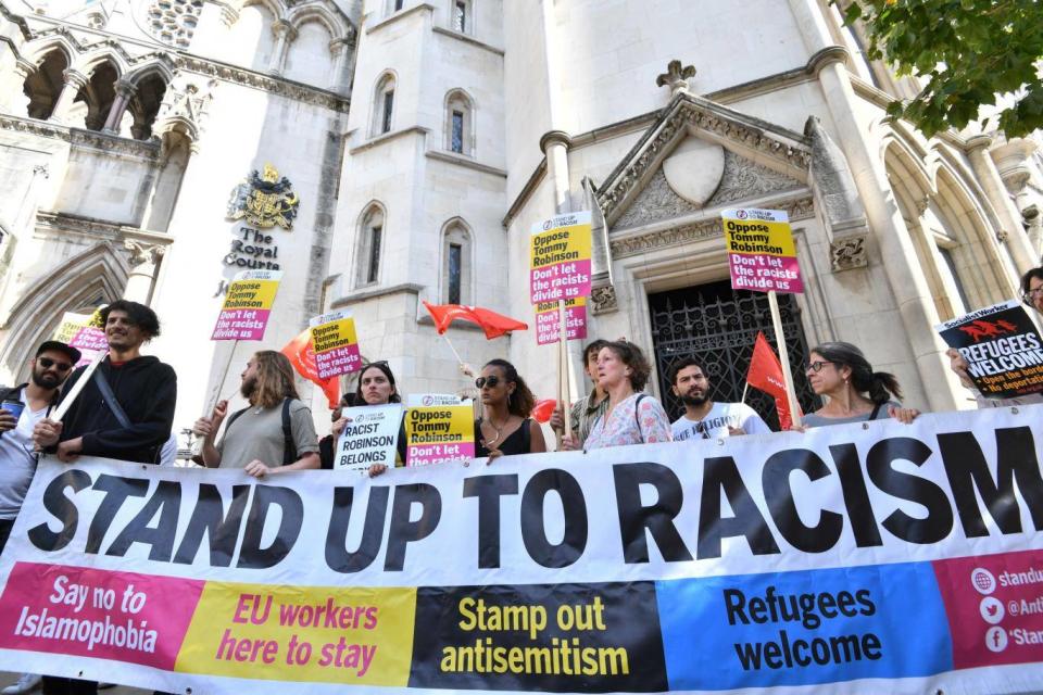 Counter-protesters outside the court (PA)