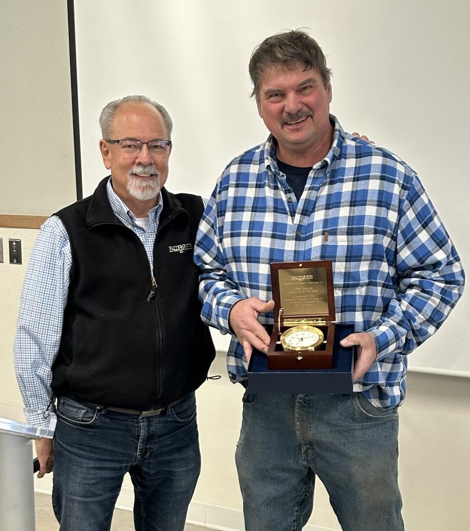 Manitowoc-based Burger Boat Company named Lance Gaedtke (right) its 2023 Associate of the Year. Also pictured, at left, is Burger Boat president and CEO Jim Ruffolo.