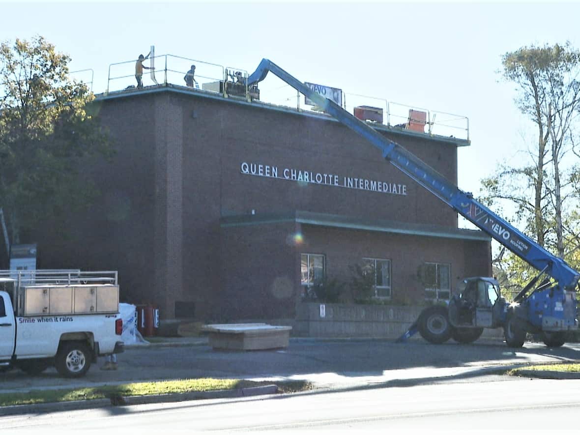 Work was continuing on the roof of Queen Charlotte School in Charlottetown on Monday. (Sheehan Desjardins/CBC - image credit)