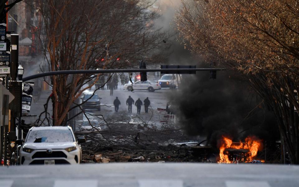 A vehicle burns near the site of an explosion in the area of Second and Commerce in Nashville - Reuters