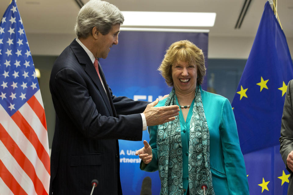 European Union High Representative Catherine Ashton, right, laughs as U.S. Secretary of State John Kerry, turns to give her a hug at the start of a US-EU Energy Dialogue meeting at the headquarters of the European Union in Brussels Wednesday April 2, 2014. (AP Photo/Jacquelyn Martin, Pool)