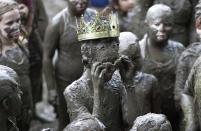 <p>Mackenna Kofahl, 12, removes her goggles after being crowned 2017 Queen of Mud Day at the Nankin Mills Park, July 11, 2017 in Westland, Mich. (Photo: Carlos Osorio/AP) </p>