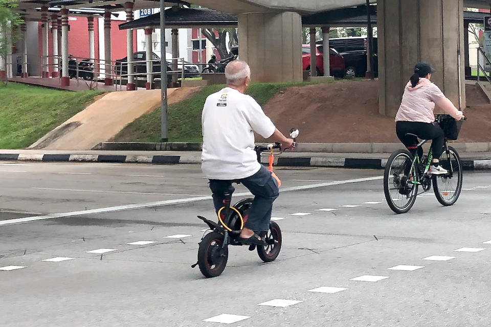 An elderly man on an e-scooter seen in Jurong on 5 November 2019