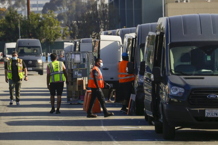 HAWTHORNE, CA - MAY 01: Packages being loaded in delivery vans at Amazon warehouse facility in Hawthorne. Hawthorne, CA. (Irfan Khan / Los Angeles Times)