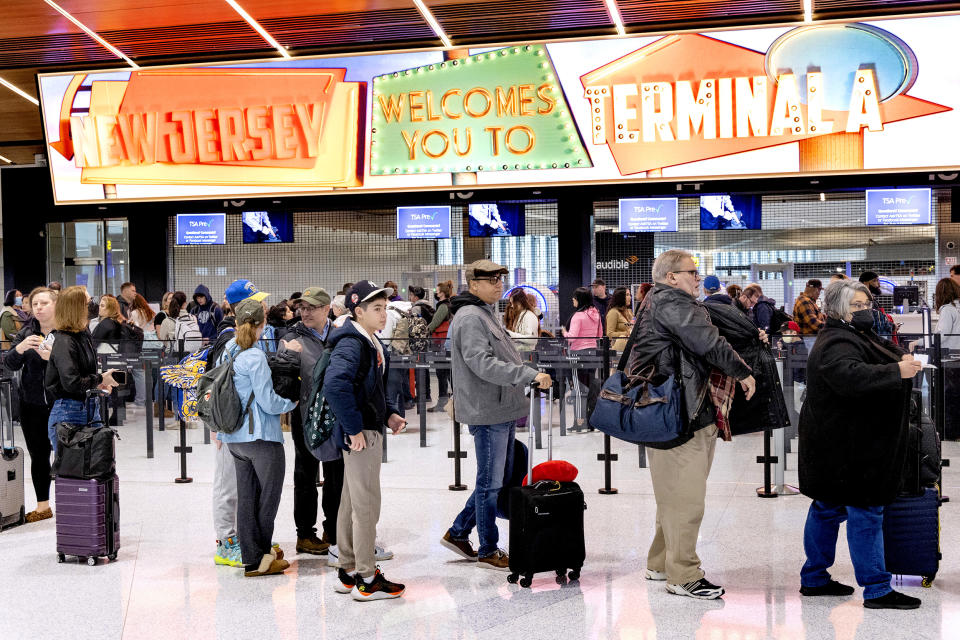 Travelers stand in line to pass through a security checkpoint at Terminal A at Newark Liberty International Airport (EWR) in Newark, N.J. on Jan. 12, 2023.  (Aristide Economopoulos / Getty Images)