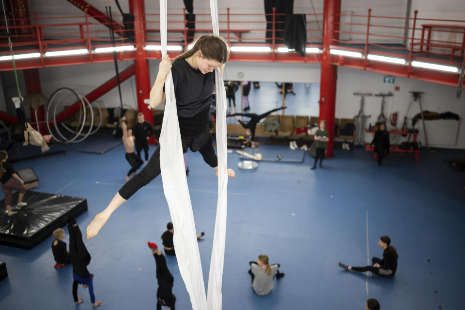 A group of young Ukrainian refugee circus students practicing in a training room in Budapest, Hungary, Monday, Feb. 13, 2023. More than 100 Ukrainian refugee circus students, between the ages of 5 and 20, found a home with the Capital Circus of Budapest after escaping the embattled cities of Kharkiv and Kyiv amid Russian bombings. (AP Photo/Denes Erdos)