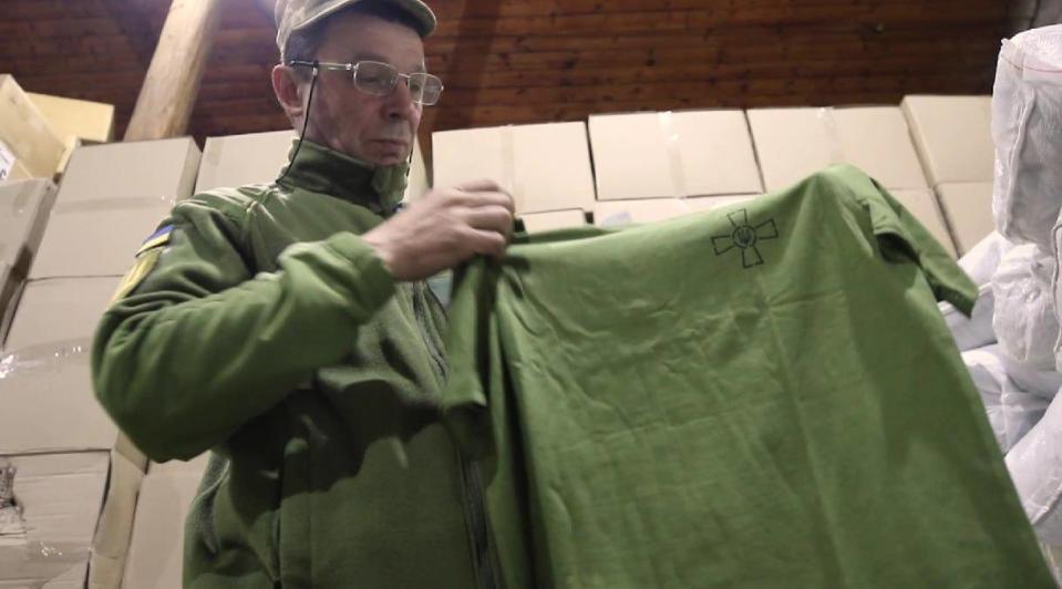 A Ukrainian soldier inspects new summer uniforms. (Ukraine MoD photo)