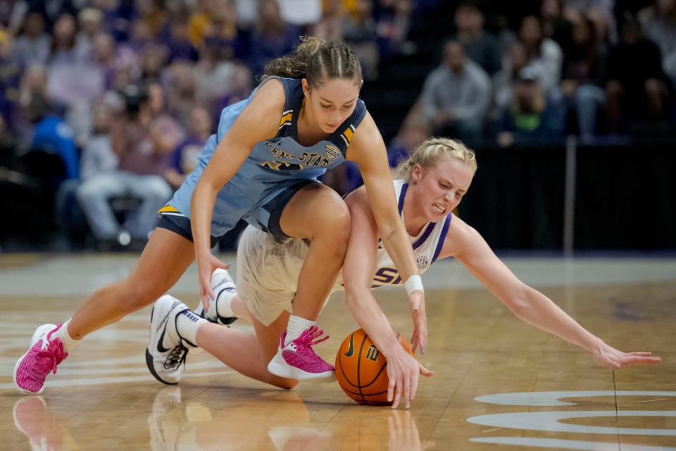 Kent State guard Corynne Hauser (3) and LSU guard Hailey Van Lith (11) battle for the ball during the first half Tuesday, Nov. 14, 2023, in Baton Rouge, La.