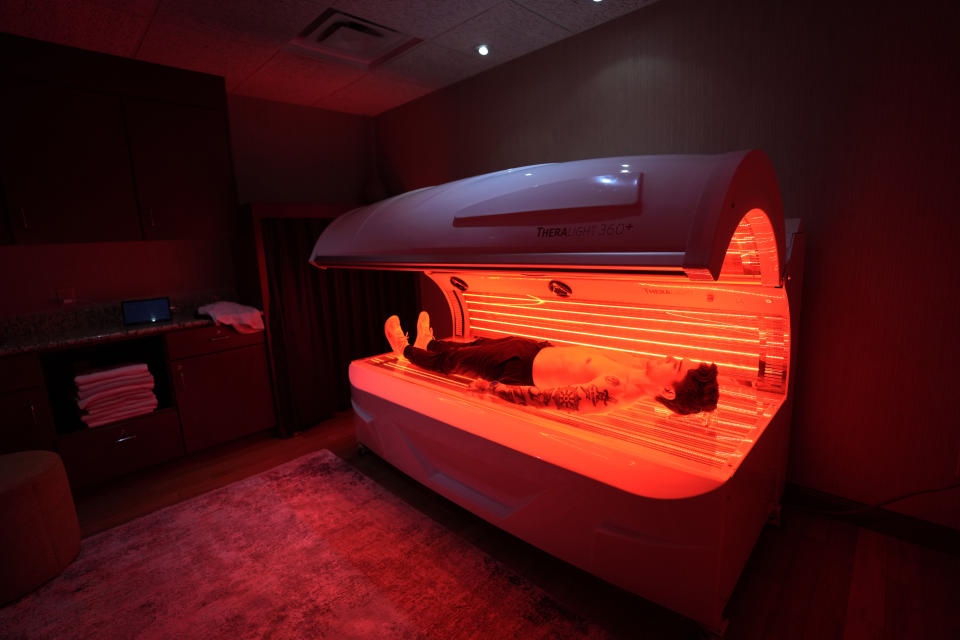 A TheraLight red light therapy bed is pictured at the MIORA clinic at the Life Time at Target Center, Wednesday, April 3, 2024, in Minneapolis. Luxury athletic club operator Life Time launched a program that offers comprehensive medical testing, personalized training and a host of alternative therapies like cryotherapy. The Miora program also offers Ozempic and other weight loss drugs through the clinic that opened in Minneapolis last year. (AP Photo/Abbie Parr)