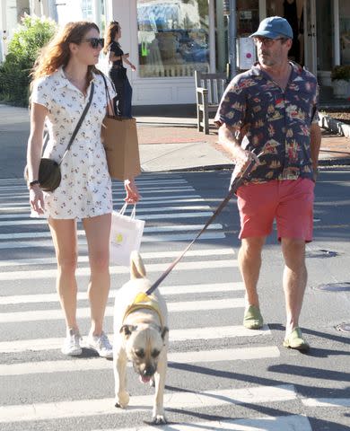 <p>Matt Agudo/SplashNews.com</p> Jon Hamm and Anna Osceola in the Hamptons, New York, on Aug. 17, 2023