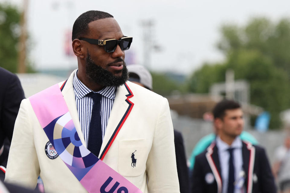 Lebron James looks on before the opening ceremony of the Paris 2024 Olympic Games. / Credit: QUINN ROONEY/POOL/AFP via Getty Images