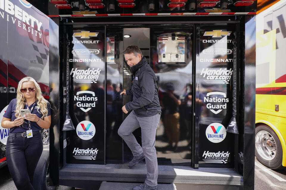 Former Nascar driver Jeff Gordon exits a Hendrick Motorsports trailer to speak at a news conference before the scheduled races at Pocono Raceway, Sunday, June 27, 2021, in Long Pond, Pa. It was announced Wednesday that Gordon was leaving the Fox Sports broadcast booth to become vice chairman at Hendrick Motorsports. (AP Photo/Matt Slocum)