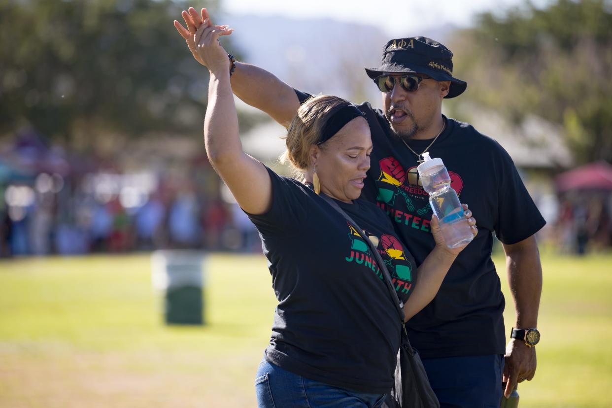 Attendees dance as Charley and his wife Kisha perform at the 2nd Annual Juneteenth Celebration at Nations Tobin Park in Northeast El Paso, TX, on Saturday, June 15, 2024.