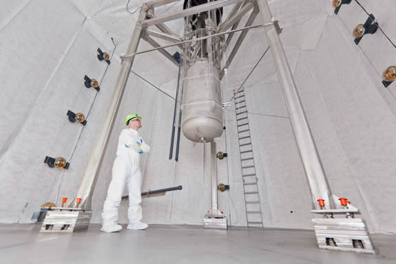 LUX physicist Jeremy Mock inspected the LUX detector before the large tank was filled with more than 70,000 gallons of ultra-pure water. The water shields the detector from background radiation.