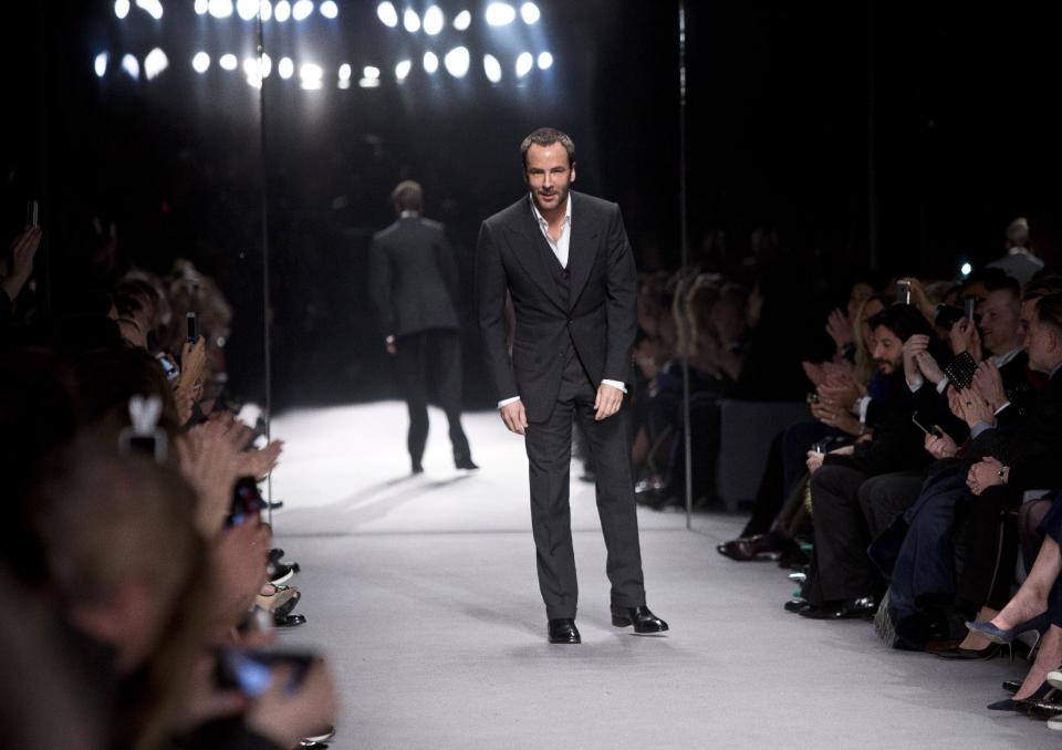Designer Tom Ford takes the applause following his show during London Fashion Week Autumn/Winter 2014, at Lindley Hall in central London, Monday, Feb. 17, 2014. (Photo by Joel Ryan/Invision/AP)