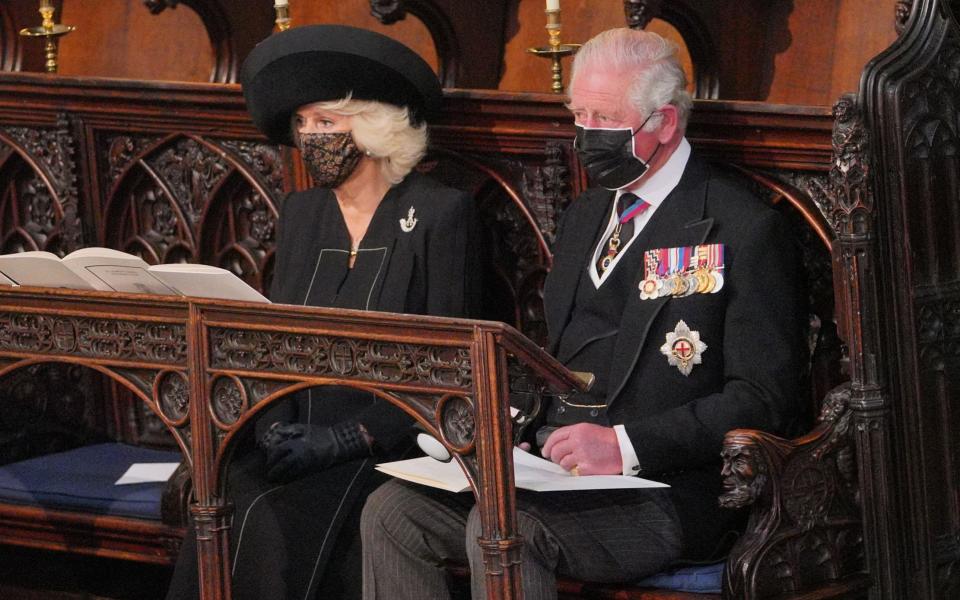 Camilla, Duchess of Cornwall, wore a lace face mask - AFP