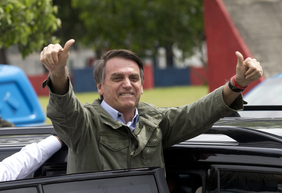 Jair Bolsonaro, presidential candidate with the Social Liberal Party, gives a thumbs up after voting in the presidential runoff election in Rio de Janeiro, Brazil, Sunday, Oct. 28, 2018. Bolsonaro is running against leftist candidate Fernando Haddad of the Workers’ Party. (AP Photo/Silvia izquierdo)