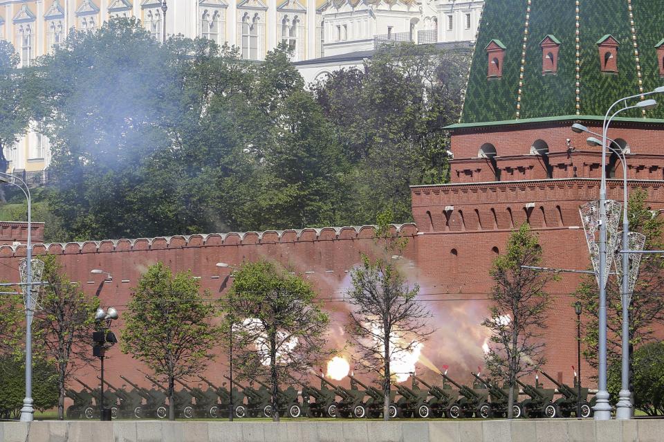 Russian cannons at the Kremlin wall are fired during a Victory Day parade in Red Square, Russia, Friday, May 9, 2014. Russia marked the Victory Day on May 9 holding a military parade in Red Square in Moscow. (AP Photo/Denis Tyrin)