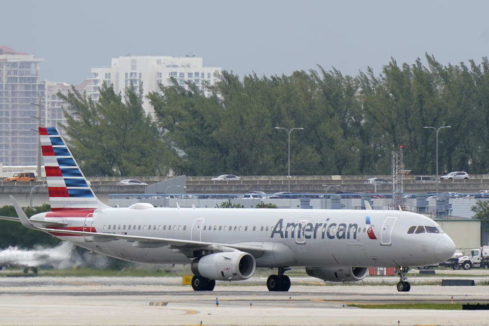 An American Airlines Airbus A321-231 taxies to the gate, Tuesday, Oct. 20, 2020, at Fort Lauderdale-Hollywood International Airport in Fort Lauderdale, Fla. Airlines are continuing to pile up billions of dollars in losses as the pandemic causes a massive drop in air travel. American Airlines said Thursday, Oct. 22, that it lost $2.4 billion in the normally strong third quarter, which includes most of the summer vacation season. (AP Photo/Wilfredo Lee)