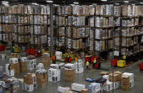 Workers pick orders at the PC World and Carphone Warehouse distribution centre in Newark, Britain November 21, 2017. REUTERS/Darren Staples