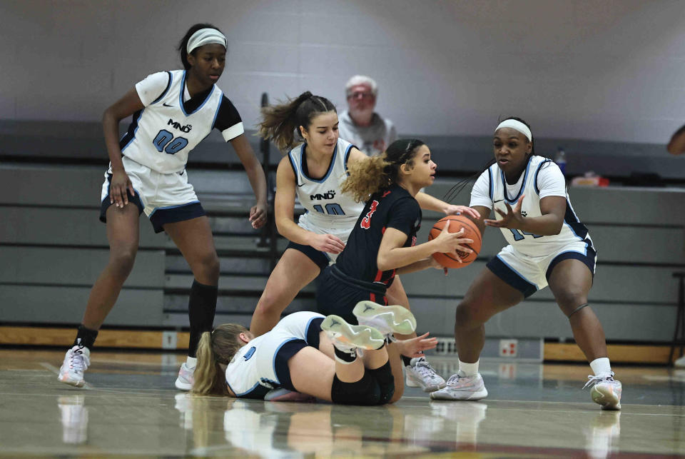 Wayne guard Janaya Lenior (3) is surrounded by Notre Dame players Laila Harrison, Kailee Bransford and Sarah Hofmann during their district final Saturday, March 2, 2024.