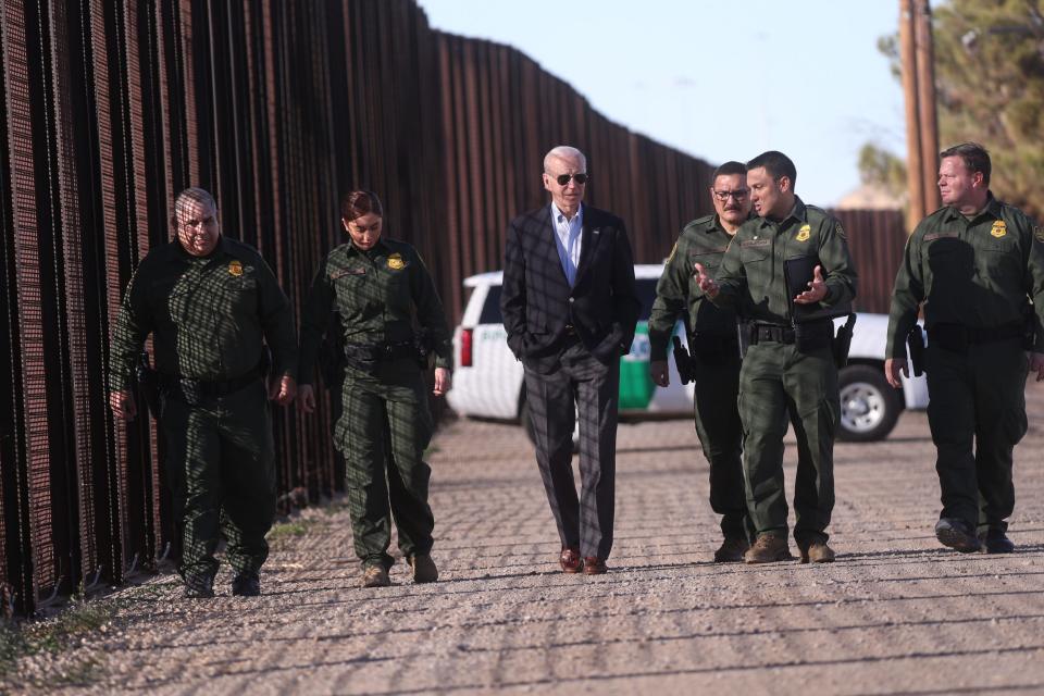 President Joe Biden walks along the border wall with Customs and Border Protection agents during his visit to El Paso, Texas on Jan. 8, 2022. The president visited the border city prior to heading to the North American Summit in Mexico City.