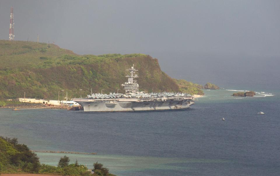 The USS Theodore Roosevelt docked at Naval Base Guam in Apra Harbor on April 27. (Photo: TONY AZIOS via Getty Images)