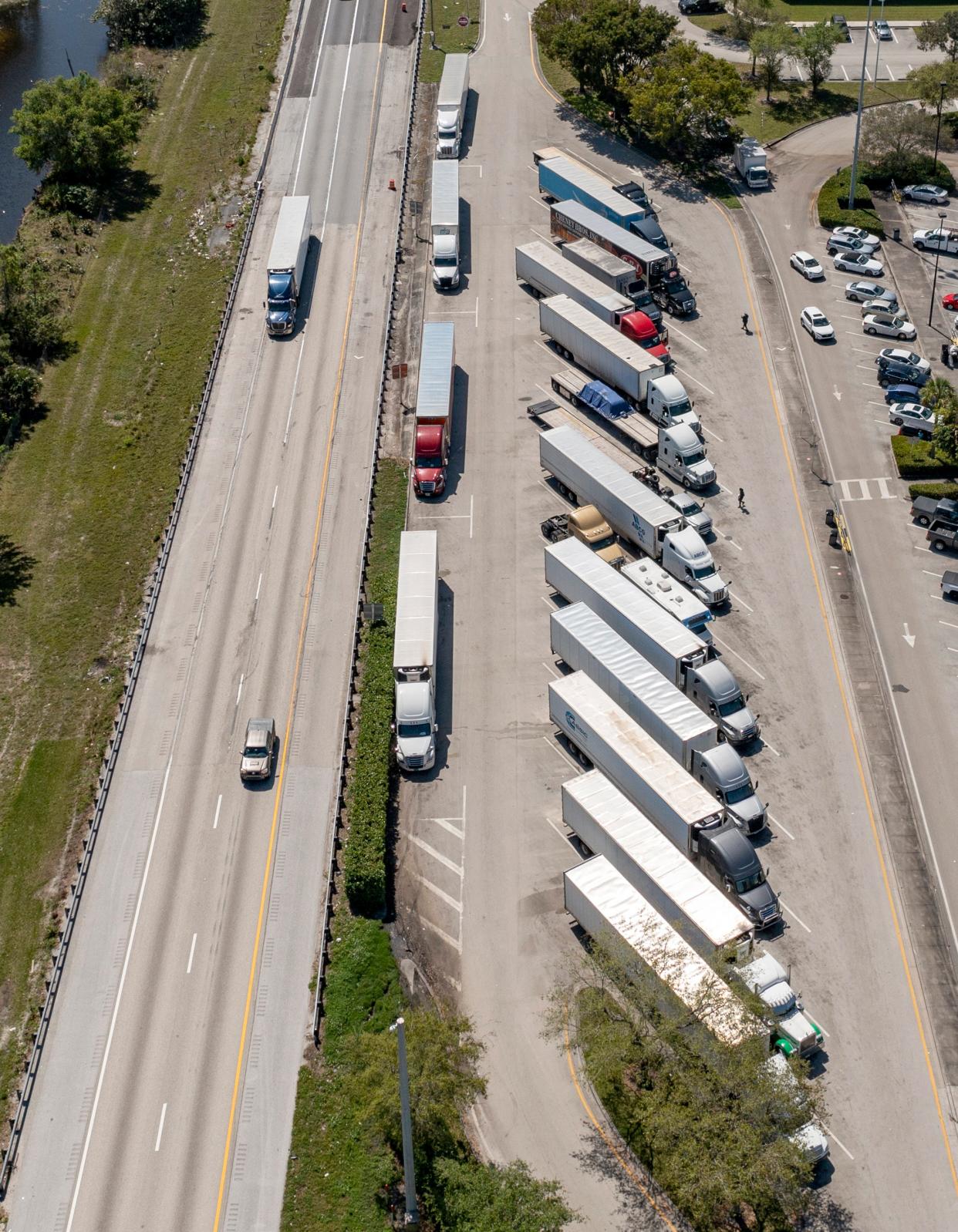 The parking lot for truck drivers is full on the northbound side of the Florida Turnpike service plaza in West Palm Beach on March 11. Truckers who park their rigs at their homes in The Acreage will have to find another place to park by July 1.