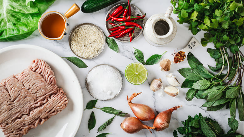 ingredients for larb-style turkey wraps on marble counter