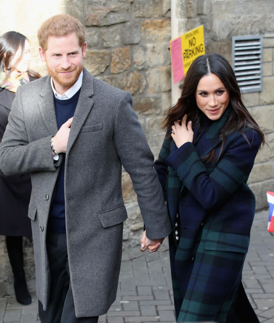 Harry and Meghan are always holding hands or walking arm in arm. Photo: Getty