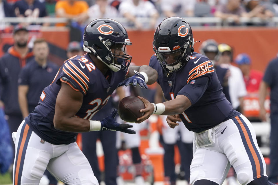 Chicago Bears quarterback Justin Fields hands off to running back David Montgomery during the first half of an NFL football game against the Detroit Lions Sunday, Oct. 3, 2021, in Chicago. (AP Photo/David Banks)