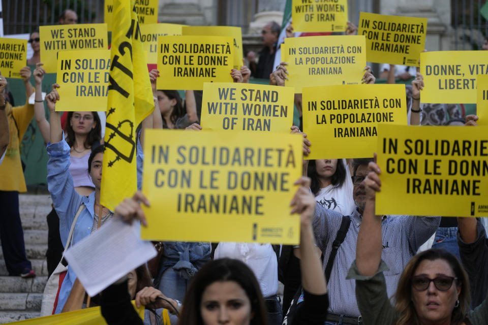 FILE - Amnesty International activists organize a sit-in at Rome's Capitol Hill in solidarity with protesters in Iran, in Rome, Wednesday, Oct. 5, 2022. As anti-government protests roil cities and towns in Iran for a fourth week, sparked by the death of a 22-year-old woman detained by Iran's morality police, tens of thousands of Iranians living abroad have marched on the streets of Europe, North America and beyond in support of what many believe to be a watershed moment for their home country. (AP Photo/Gregorio Borgia, File)