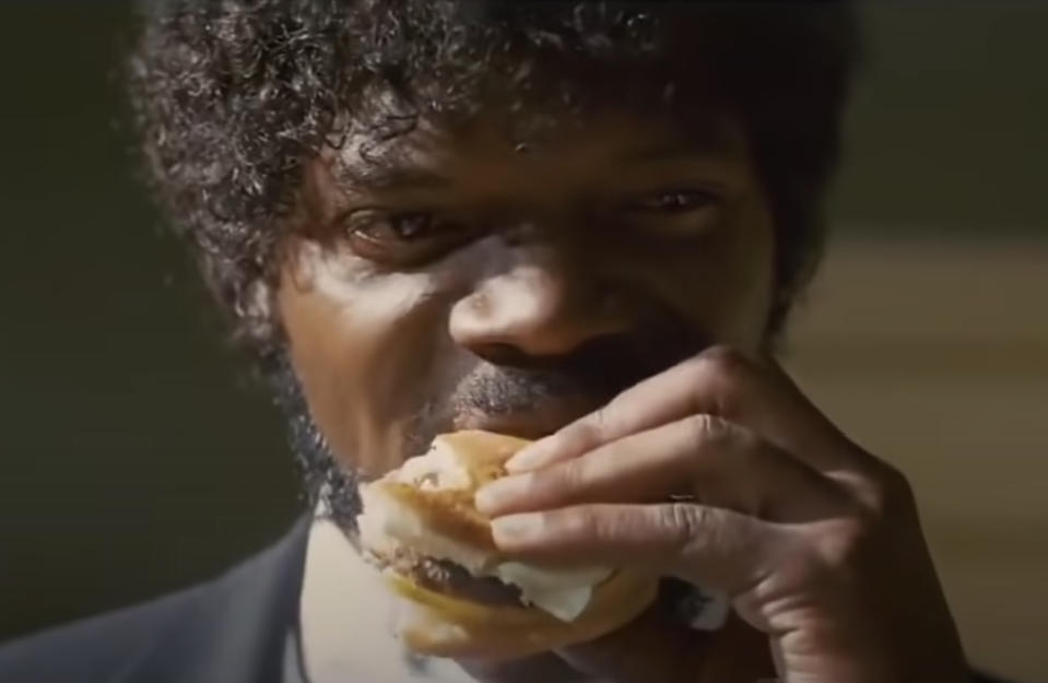 Close-up of Jules biting down on a burger in a scene from "Pulp Fiction"