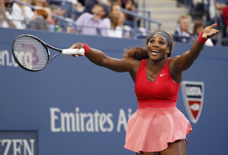 Serena Williams of the U.S. reacts to the wind while playing Azarenka of Belarus during their women's singles final match at the U.S. Open tennis championships in New York