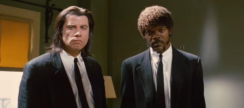 Vincent and Jules standing in an apartment suite in "Pulp Fiction"