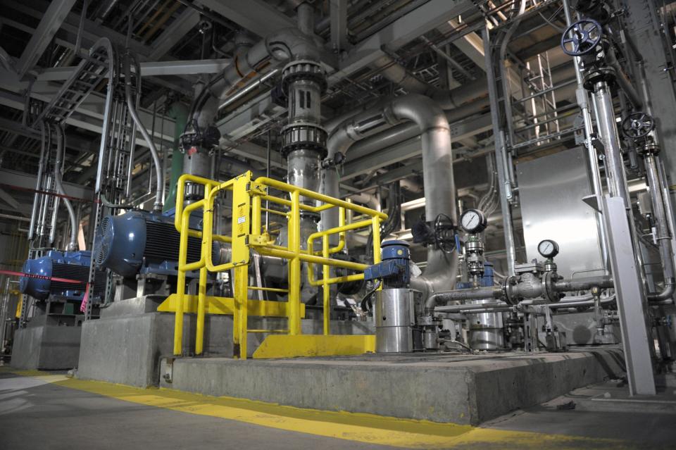 FILE - In this Oct. 2, 2014, file photo, pipes and tanks snake around the inside of a carbon capture and storage facility during the official opening of the facility at the Boundary Dam Power Station in Estevan, Saskatchewan. Boundary Dam has the only currently operational power plant-to-oilfield pipeline for carbon capture in North America. The U.S. government under Donald Trump's administration has approved routes for a system of pipelines that would move carbon dioxide across Wyoming in what could be by far the largest such network in North America, if developed. (Michael Bell/The Canadian Press, via AP, File)