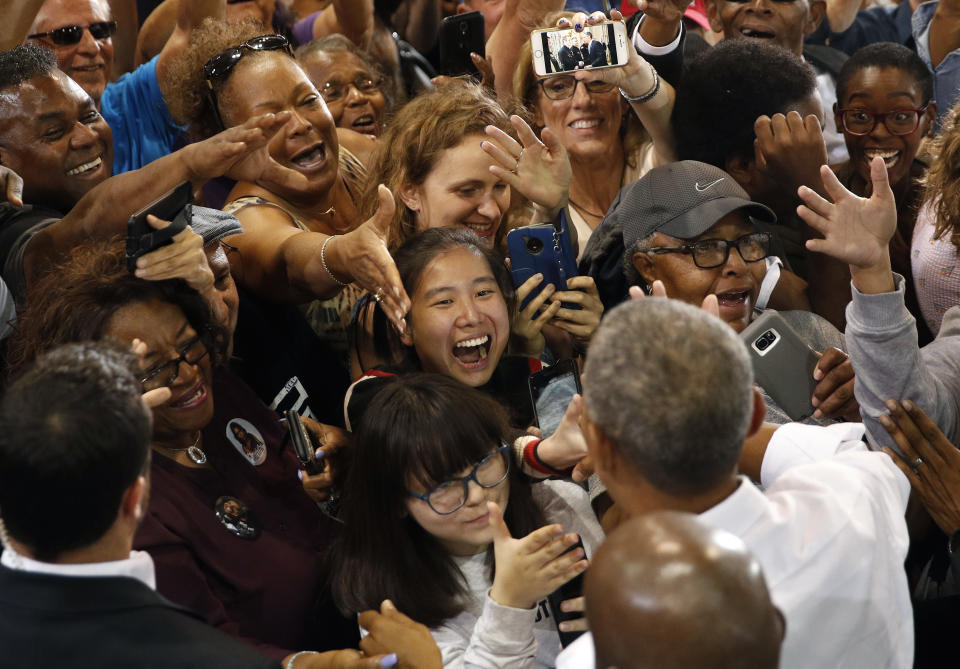 People clamor to shake hands with Former President Barack Obama at a rally in support of candidate for Senate Jacky Rosen and other Nevada Democrats, Monday, Oct. 22, 2018, in Las Vegas. (AP Photo/John Locher)