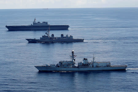 British frigate HMS Argyle (front), Japanese destroyer Inazuma (C) and Japanese helicopter carrier Kaga take part in a joint naval drill in the Indian Ocean, September 26, 2018. Picture taken September 26, 2018. REUTERS/Kim Kyung-Hoon