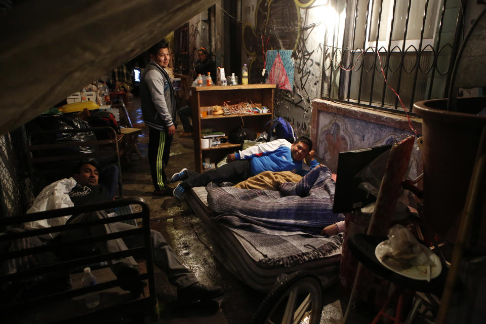 <em>Families are being forced to sleep on the pavements after their homes were destroyed (AP)</em>