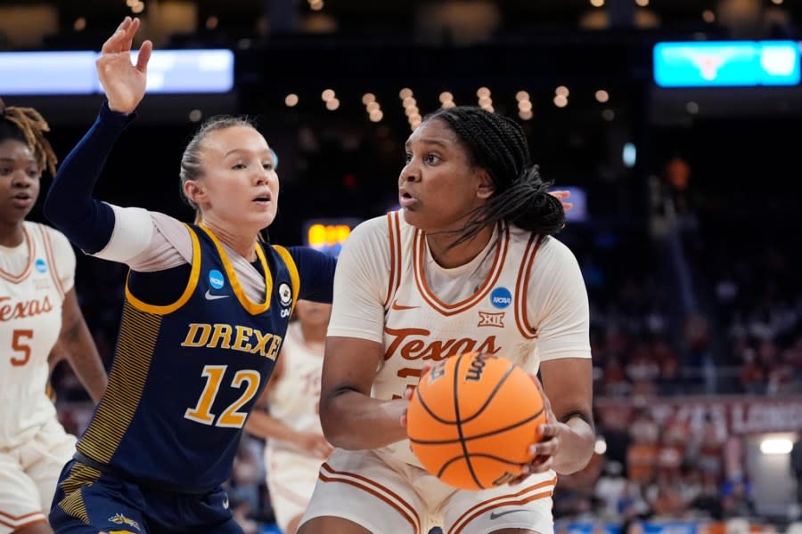 Texas forward Madison Booker, right, looks to pass around Drexel guard Grace O’Neill (12) during the first half of a first-round college basketball game in the women’s NCAA Tournament in Austin, Texas, Friday, March 22, 2024. (AP Photo/Eric Gay)