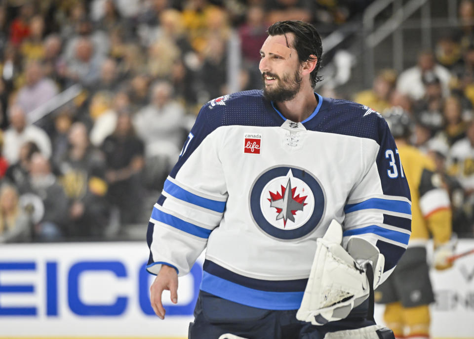 Connor Hellebuyck wants to be paid like one of the NHL's top goalies. (Photo by David Becker/NHLI via Getty Images)