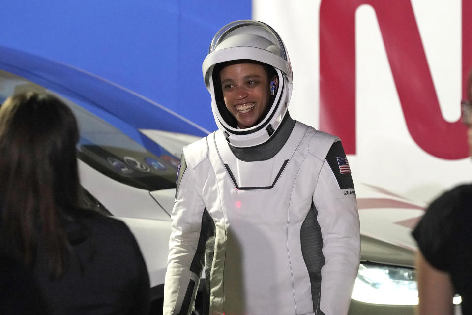 NASA Mission specialist Jessica Watkins smiles as she talks to family members after leaving the Operations and Checkout building for a trip to Launch Complex 39-A Wednesday, April 27, 2022, at the Kennedy Space Center in Cape Canaveral, Fla. Four astronauts will fly on SpaceX's Crew-4 mission to the International Space Station. (AP Photo/John Raoux)