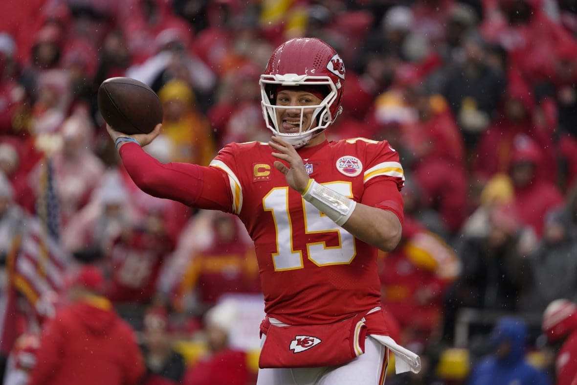Kansas City Chiefs quarterback Patrick Mahomes (15) passes against the Jacksonville Jaguars during the first half of an NFL divisional round playoff football game, Saturday, Jan. 21, 2023, in Kansas City, Mo. (AP Photo/Ed Zurga)
